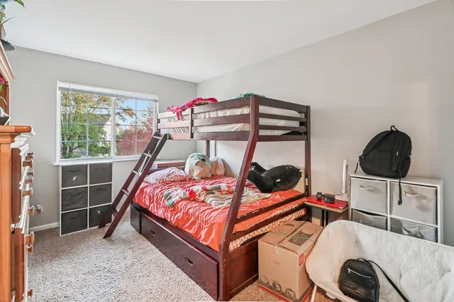 a bedroom with furniture and a window