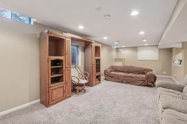 a living room with furniture and a walk in closet