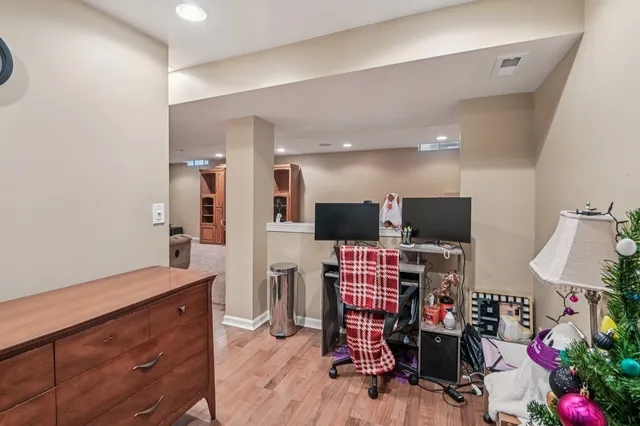 a view of a livingroom with furniture and a flat screen tv