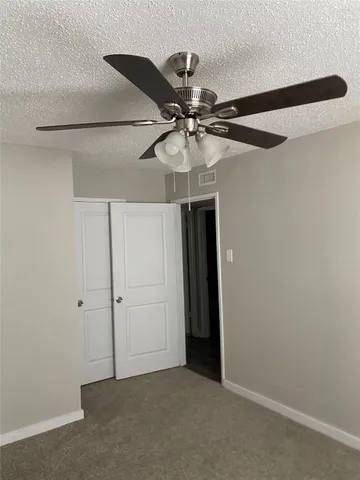 a view of a small space with a fan