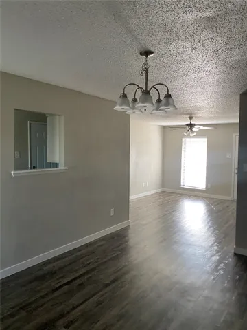 a view of a room with wooden floor window and staircase