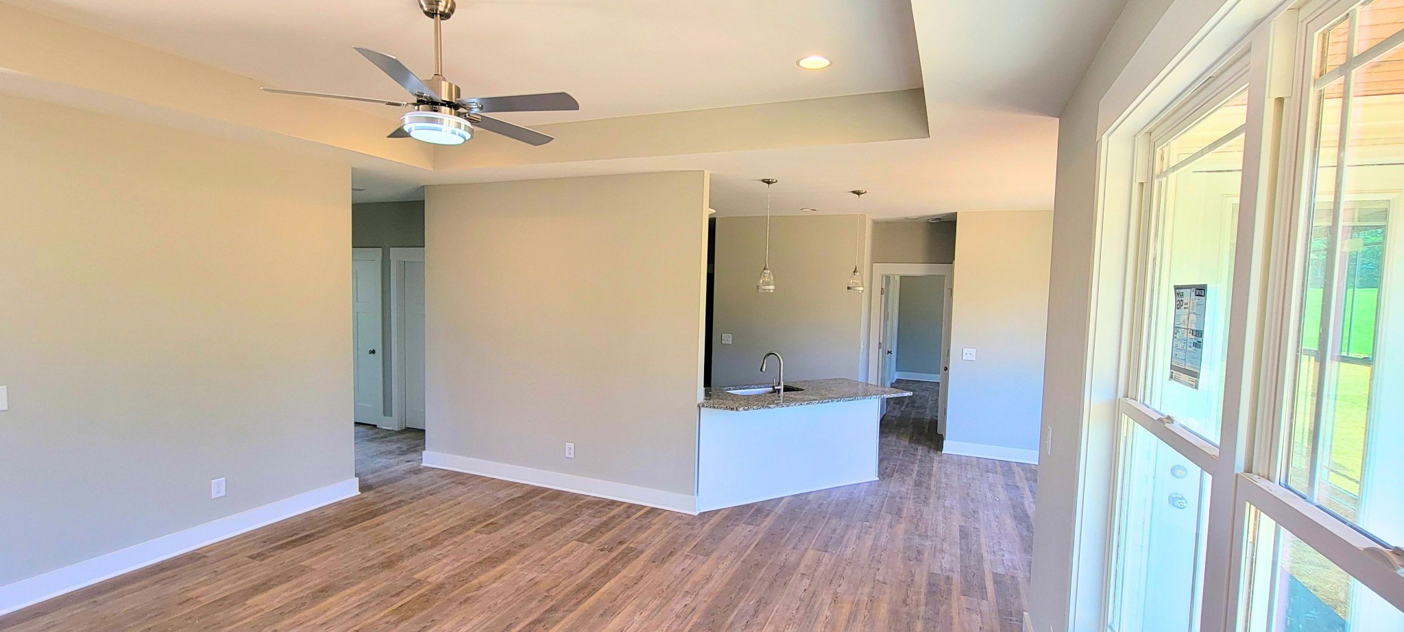 2098 Gath Lucky Road McMinnville, TN 37110 - Photo 5 of 21 a view of a hallway with wooden floor and chandelier