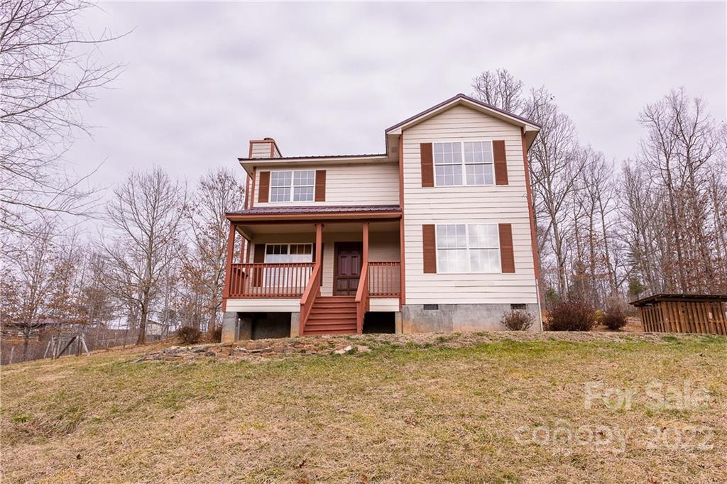 300 Boyd Road Leicester, NC 28748 - Photo 1 of 46 a front view of a house with garden