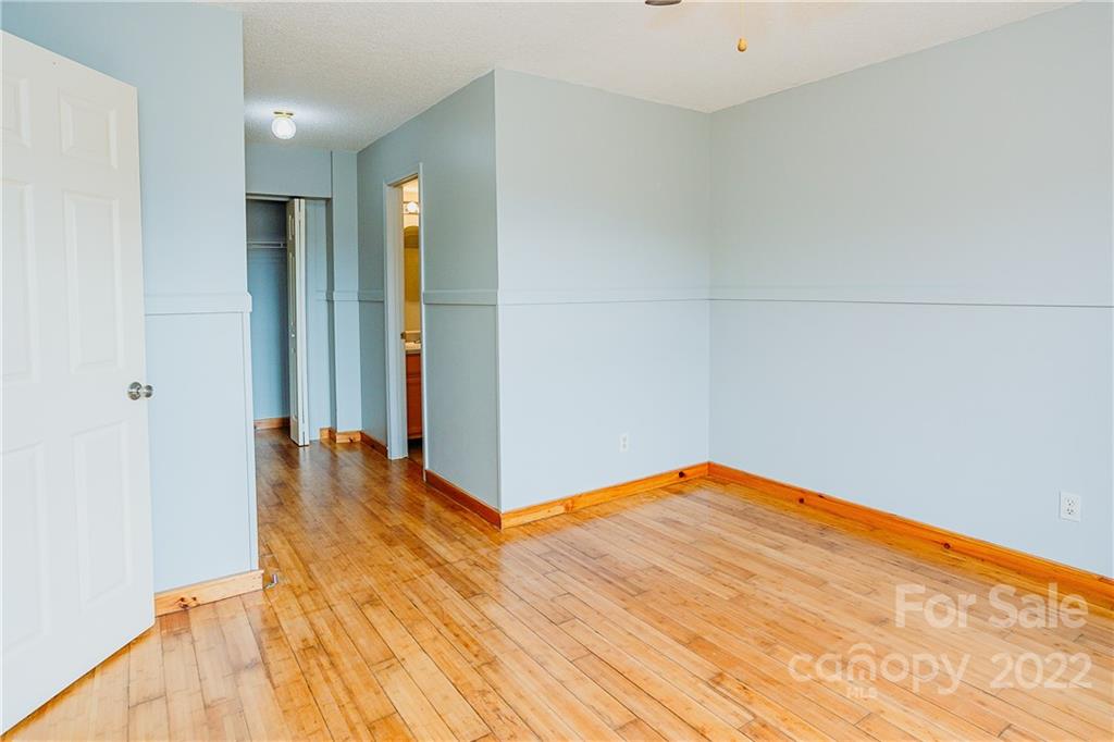 300 Boyd Road Leicester, NC 28748 - Photo 16 of 46 a view of a room with wooden floor and a bathroom