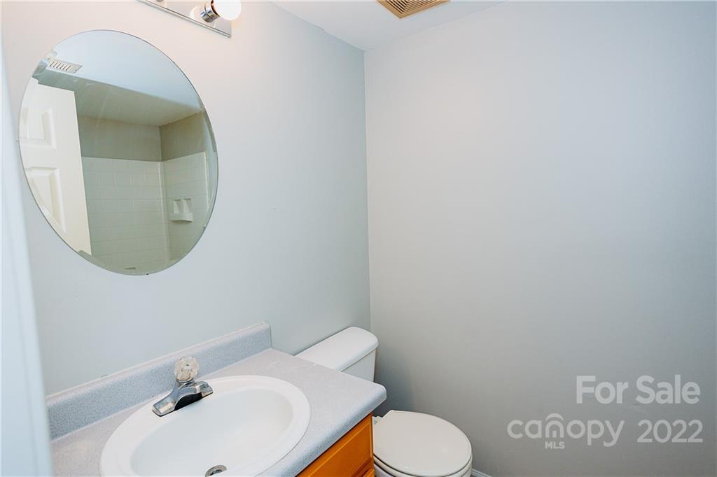 300 Boyd Road Leicester, NC 28748 - Photo 17 of 46 a bathroom with a sink and a mirror