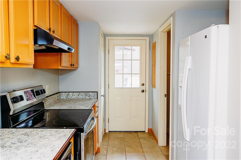 300 Boyd Road Leicester, NC 28748 - Photo 2 of 46 a kitchen with a stove a refrigerator and a sink