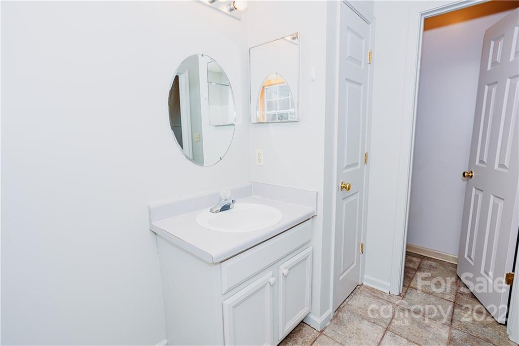 300 Boyd Road Leicester, NC 28748 - Photo 28 of 46 a bathroom with a sink and mirror