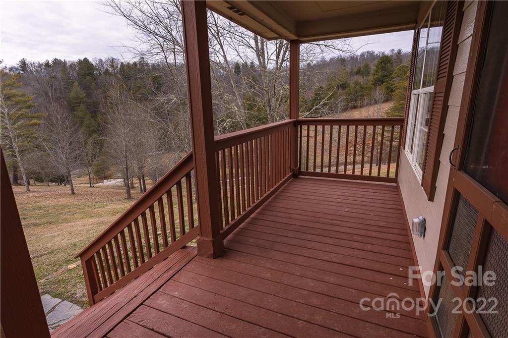 300 Boyd Road Leicester, NC 28748 - Photo 32 of 46 a view of a wooden balcony with wooden floor and fence