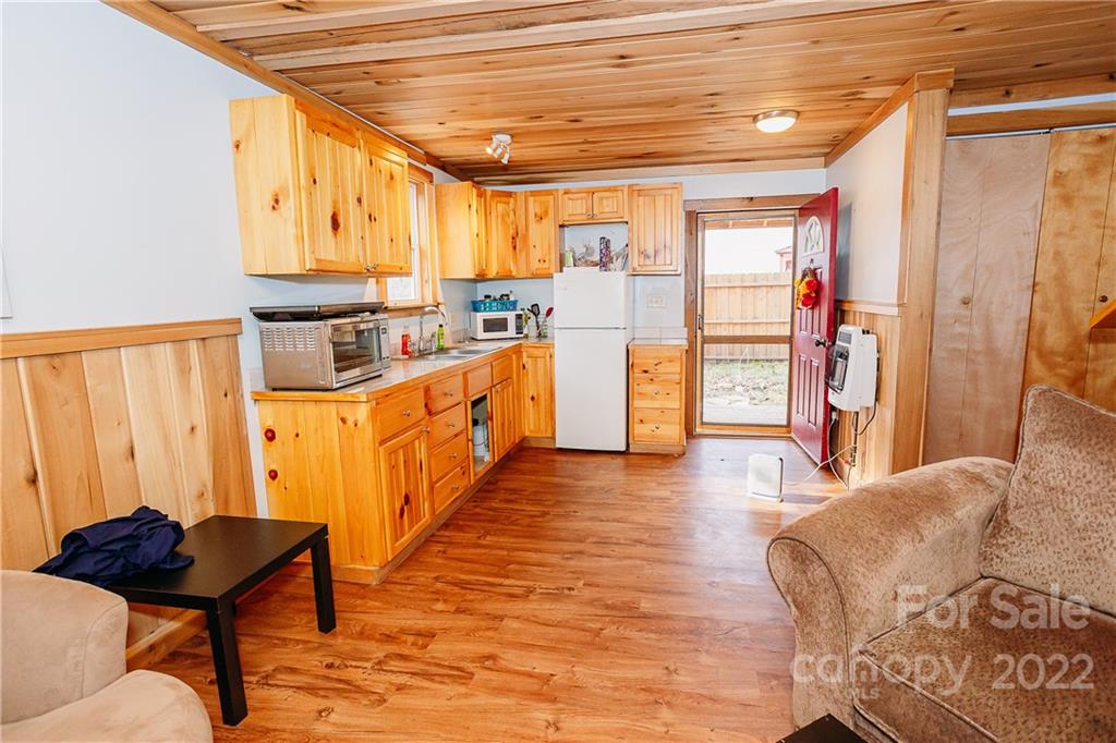 300 Boyd Road Leicester, NC 28748 - Photo 45 of 46 a living room with furniture and a wooden floor