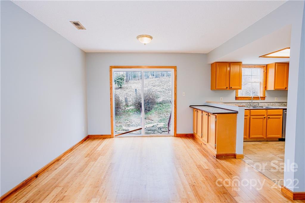 300 Boyd Road Leicester, NC 28748 - Photo 5 of 46 a view of a room with wooden floor and a window