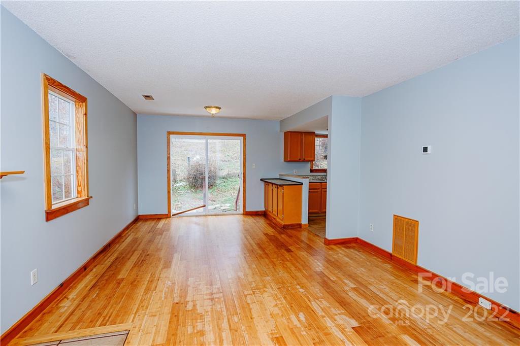 300 Boyd Road Leicester, NC 28748 - Photo 10 of 46 a bed room with a bed and wooden floor