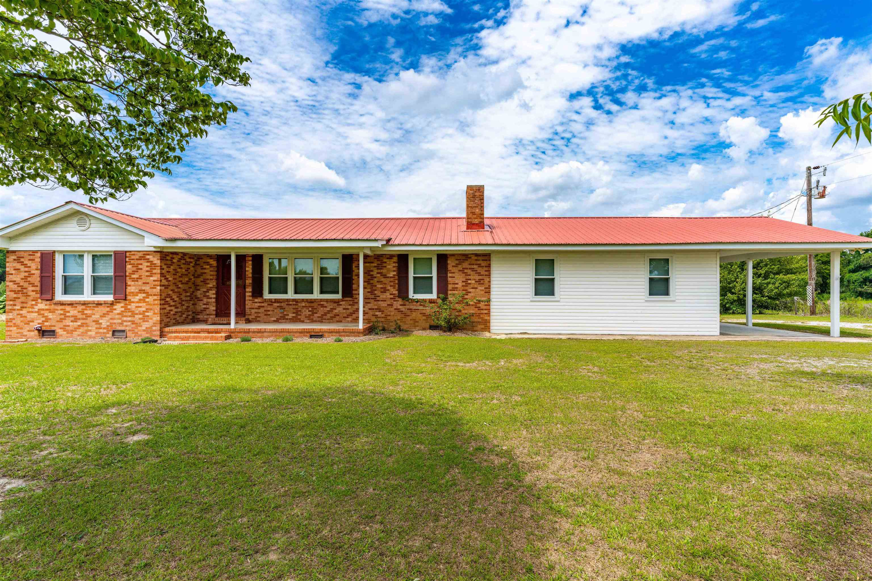 420 Faith Church Road Four Oaks, NC 27524 - Photo 1 of 36 a view of a house with a backyard