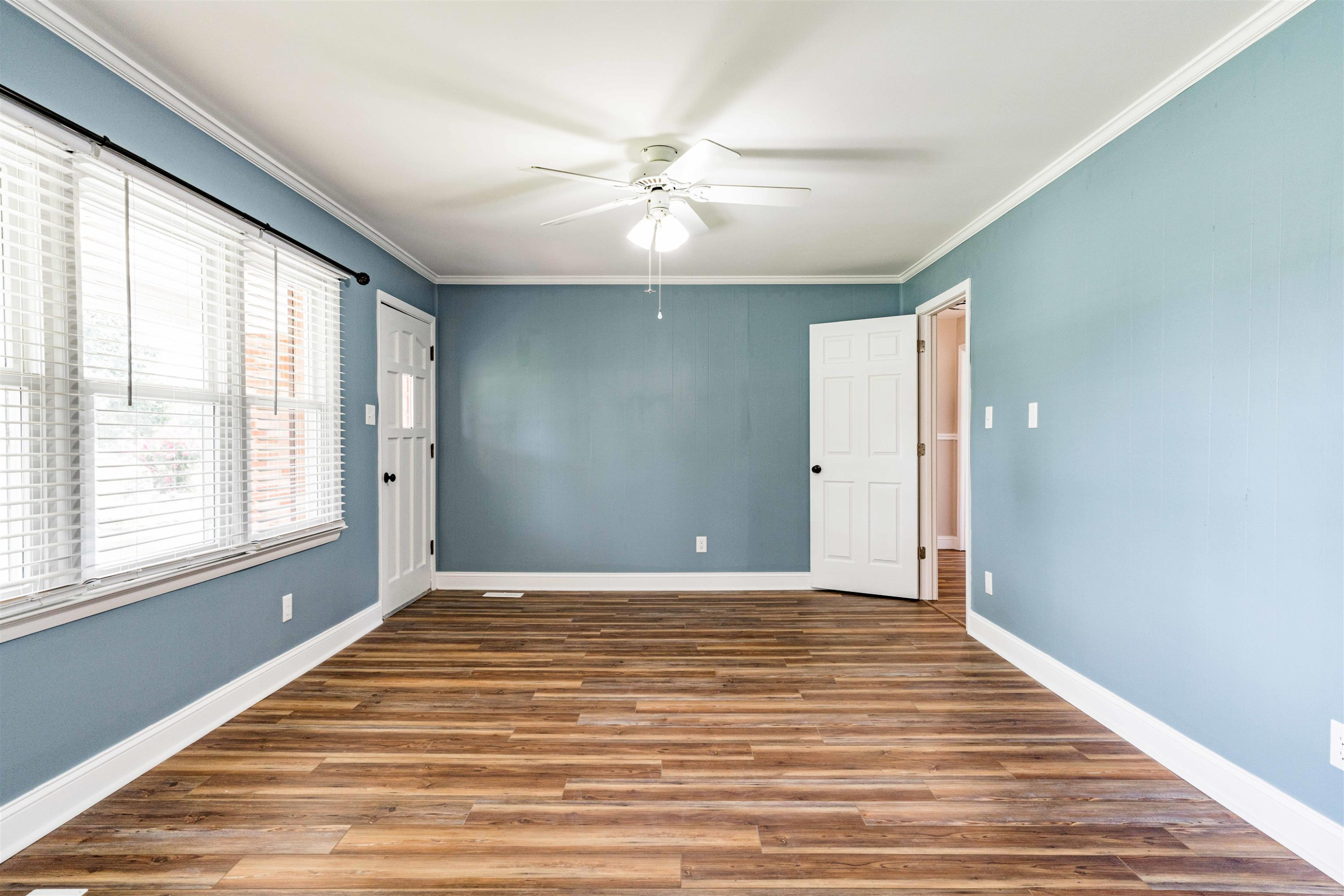 420 Faith Church Road Four Oaks, NC 27524 - Photo 11 of 36 a view of an empty room with wooden floor and a window