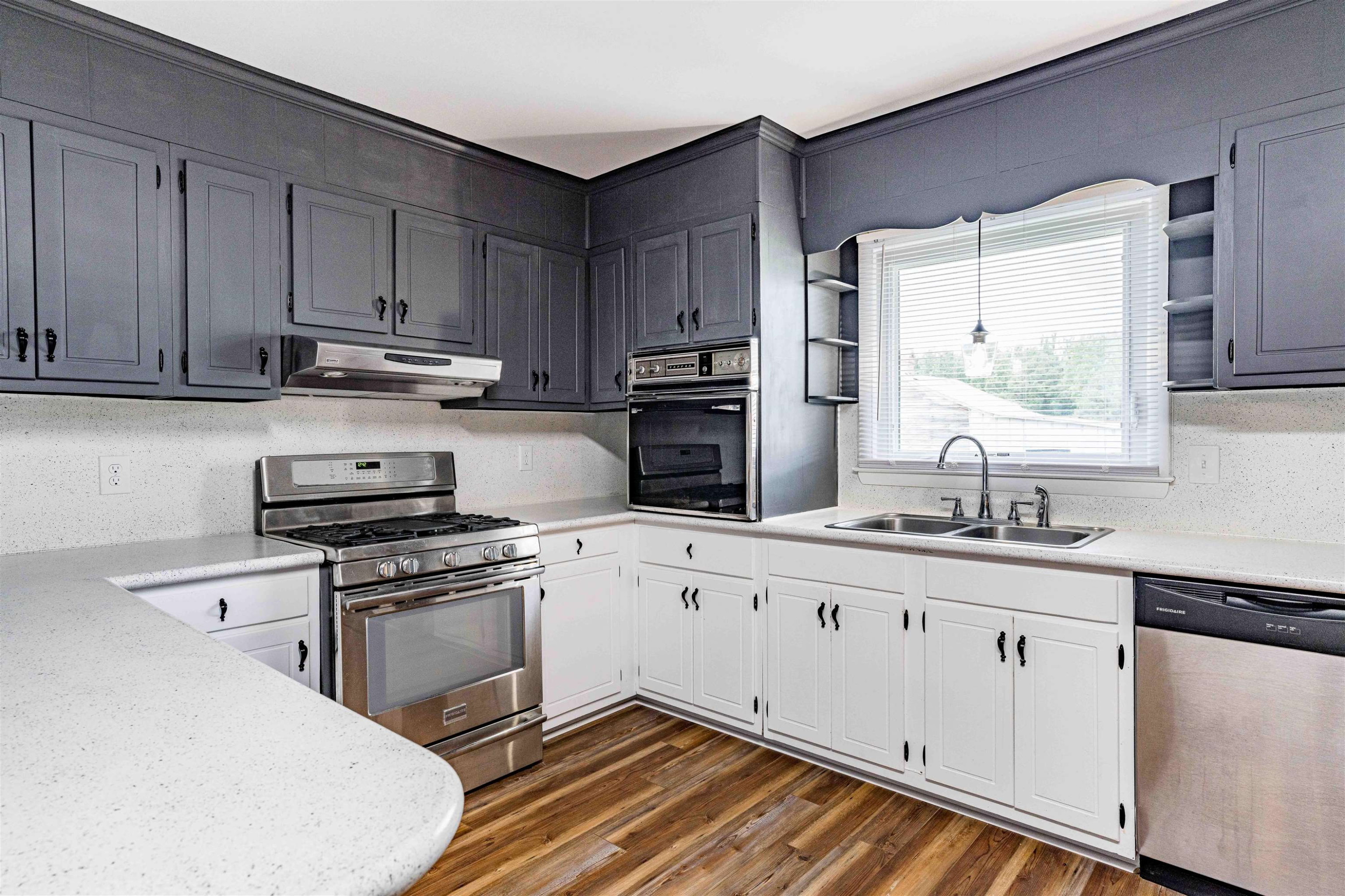420 Faith Church Road Four Oaks, NC 27524 - Photo 14 of 36 a kitchen with stainless steel appliances a sink cabinets and a window