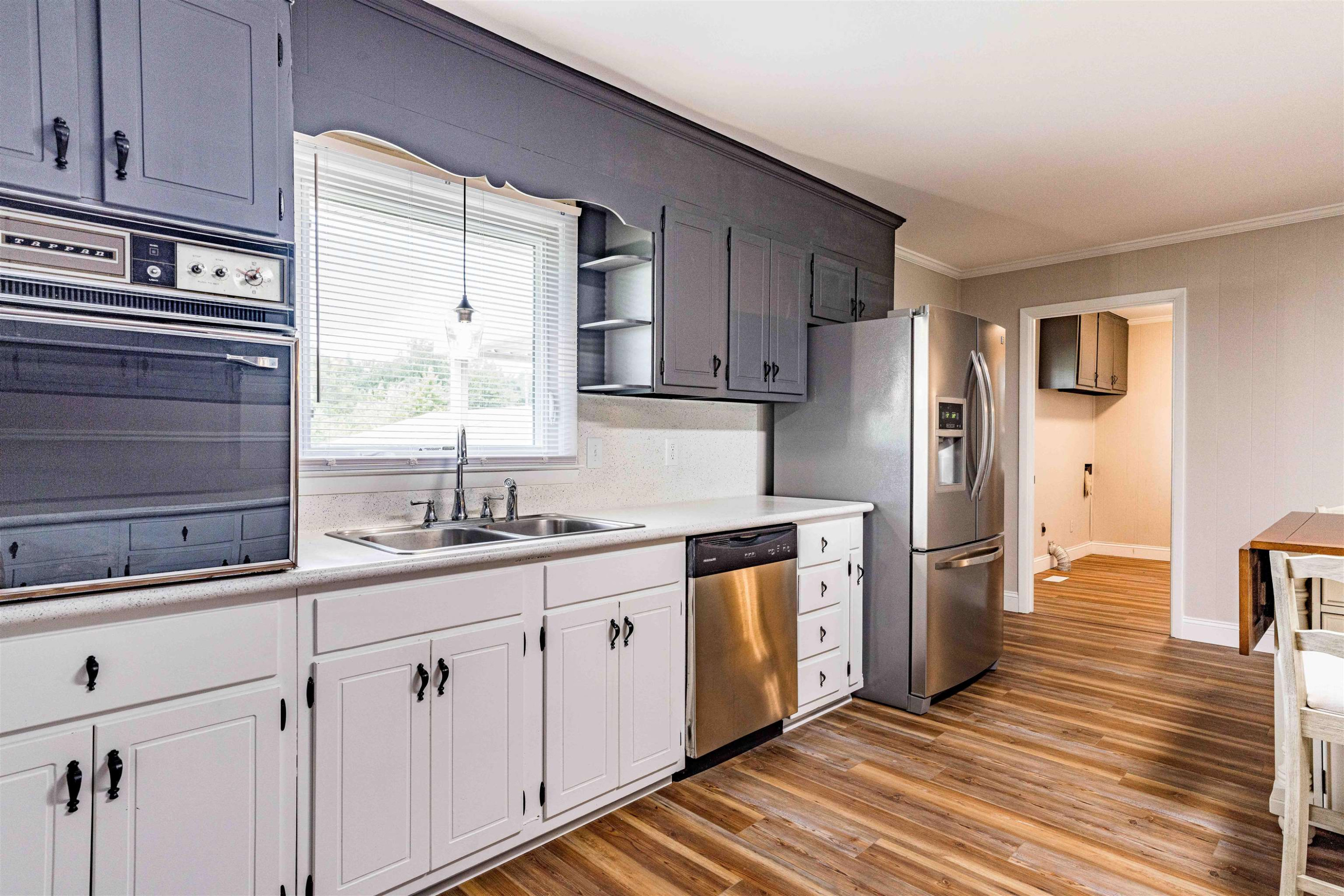 420 Faith Church Road Four Oaks, NC 27524 - Photo 16 of 36 a kitchen with a sink cabinets stainless steel appliances and a window