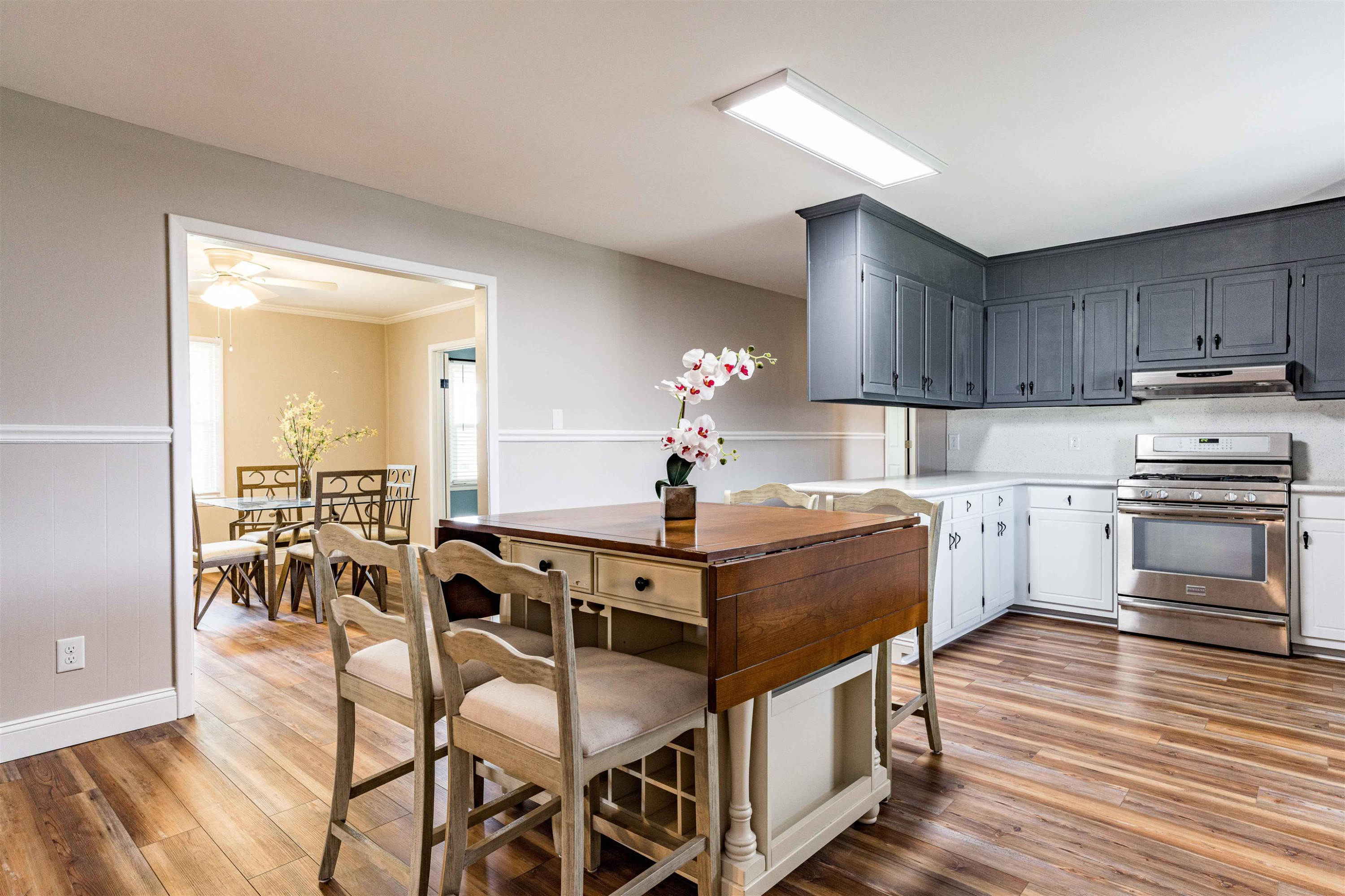 420 Faith Church Road Four Oaks, NC 27524 - Photo 18 of 36 a view of kitchen with cabinets and wooden floor