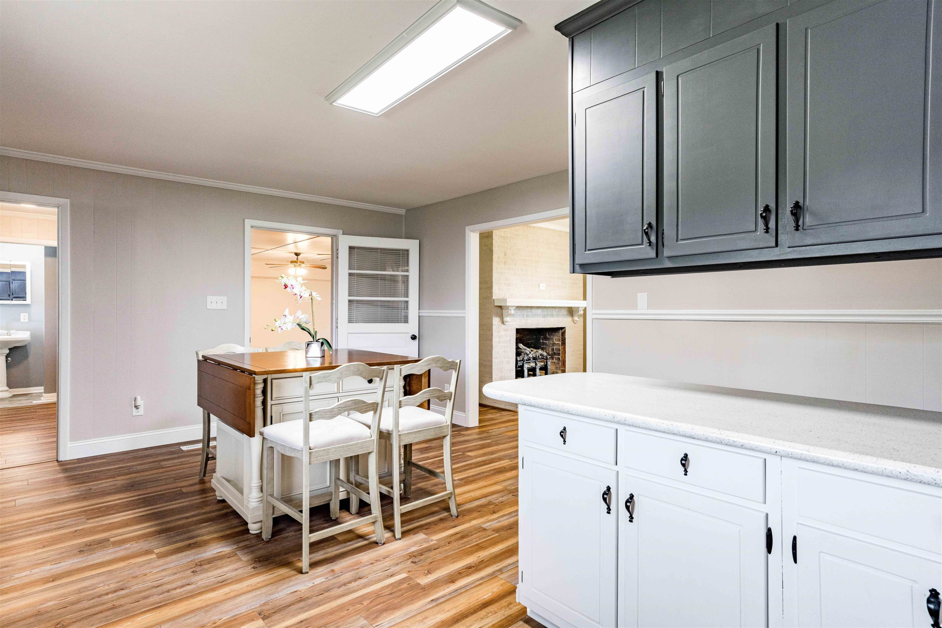 420 Faith Church Road Four Oaks, NC 27524 - Photo 20 of 36 a living room with furniture a fireplace and a wooden floor