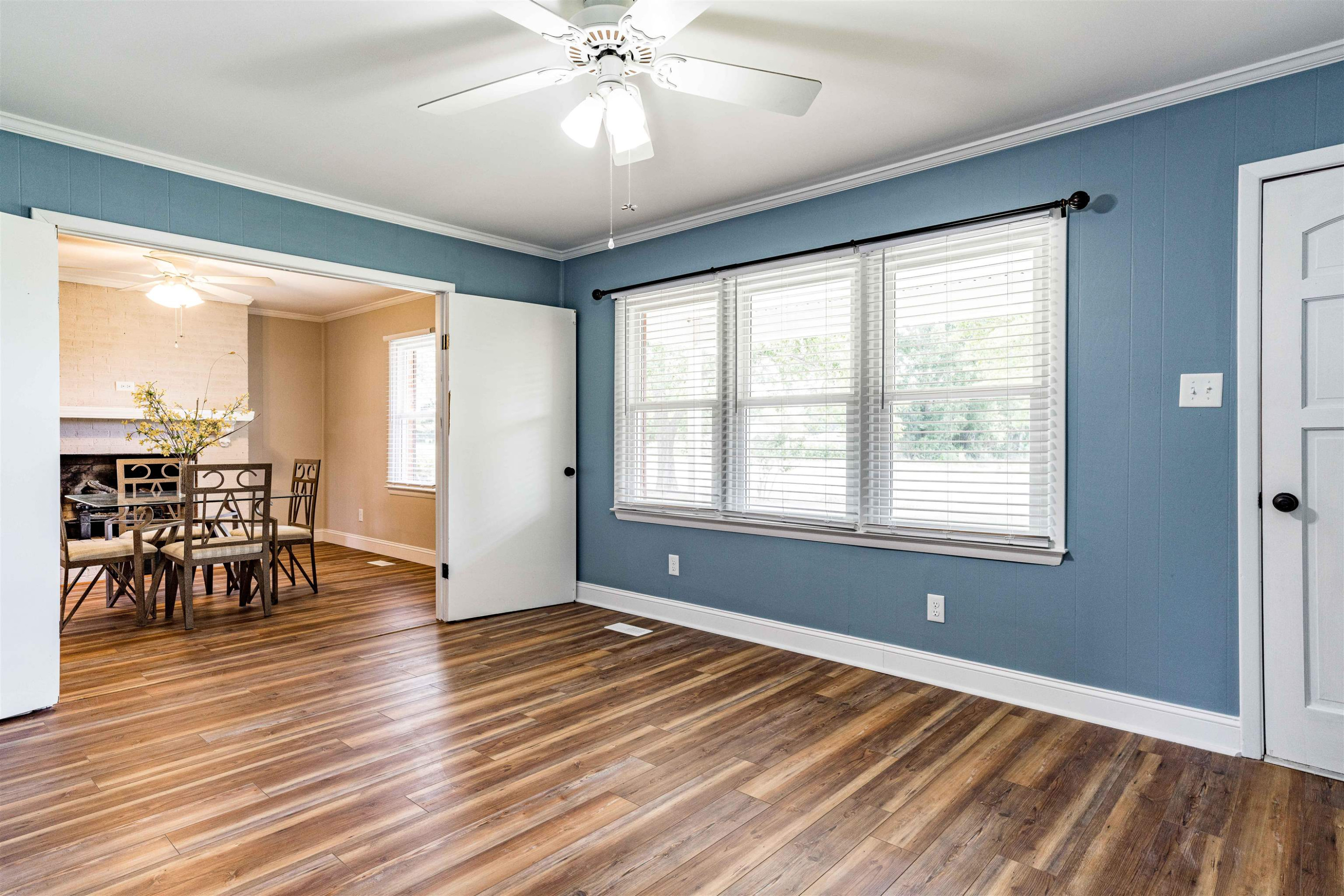 420 Faith Church Road Four Oaks, NC 27524 - Photo 21 of 36 a view of empty room with wooden floor and fan