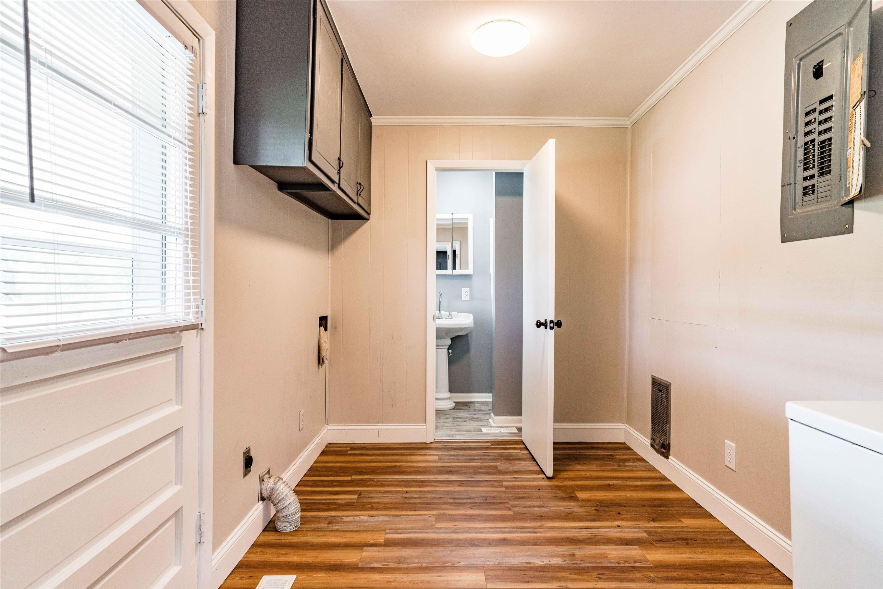 420 Faith Church Road Four Oaks, NC 27524 - Photo 22 of 36 a view of a hallway with wooden floor and staircase
