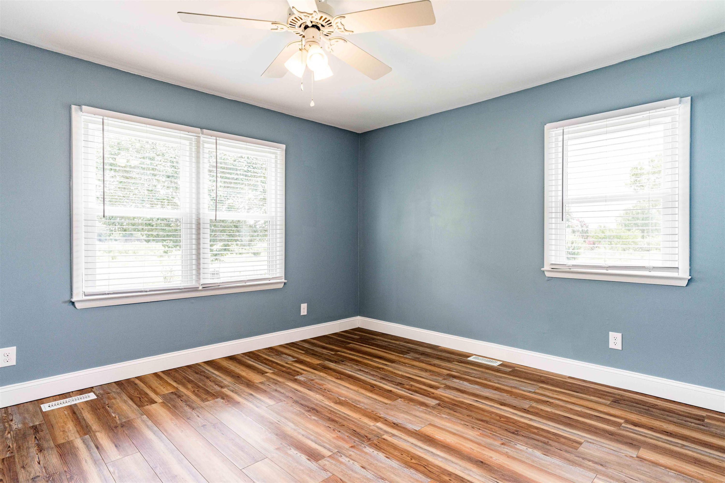 420 Faith Church Road Four Oaks, NC 27524 - Photo 26 of 36 a view of an empty room with wooden floor and a window