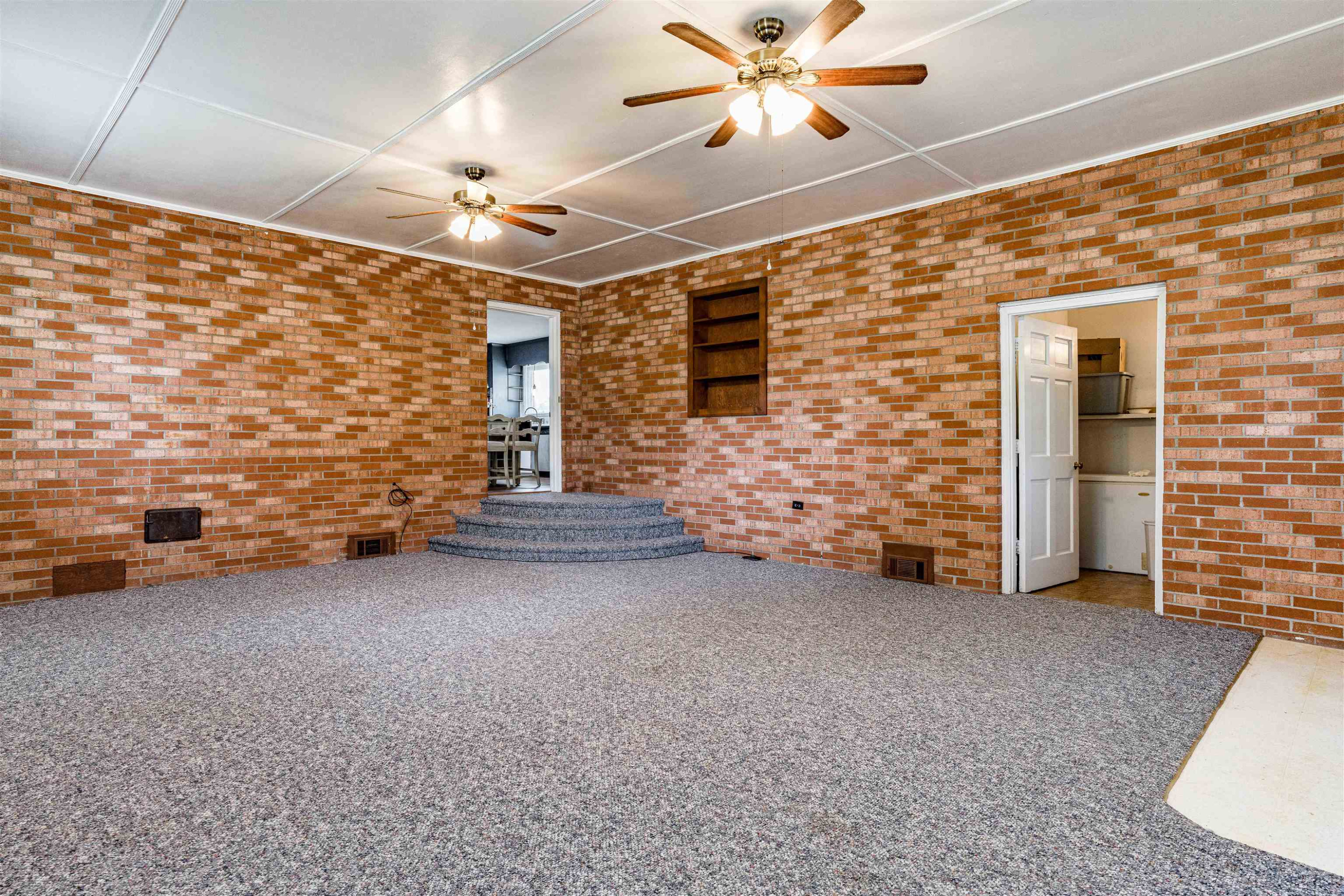 420 Faith Church Road Four Oaks, NC 27524 - Photo 27 of 36 a view of an empty room with a ceiling fan