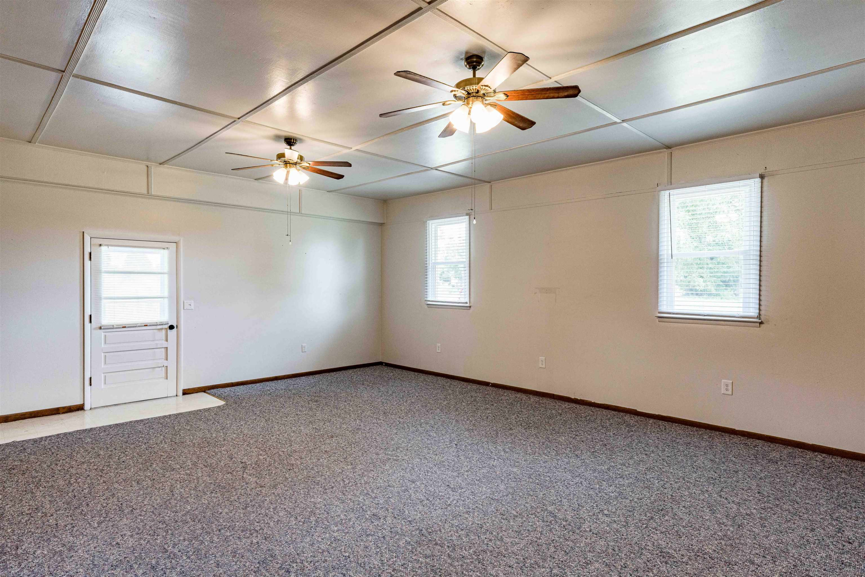 420 Faith Church Road Four Oaks, NC 27524 - Photo 28 of 36 an empty room with windows and fan