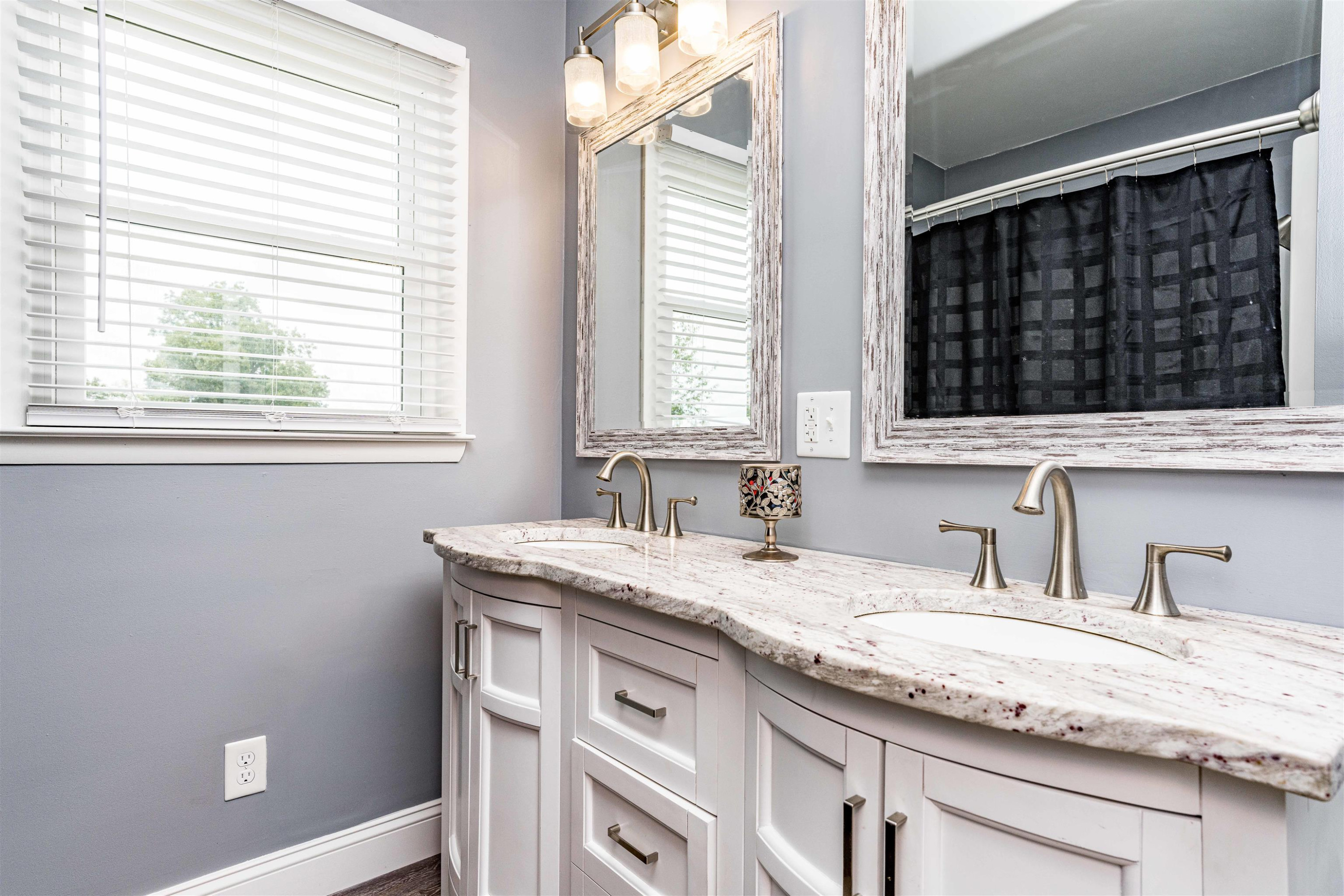 420 Faith Church Road Four Oaks, NC 27524 - Photo 33 of 36 a bathroom with a granite countertop sink and a window