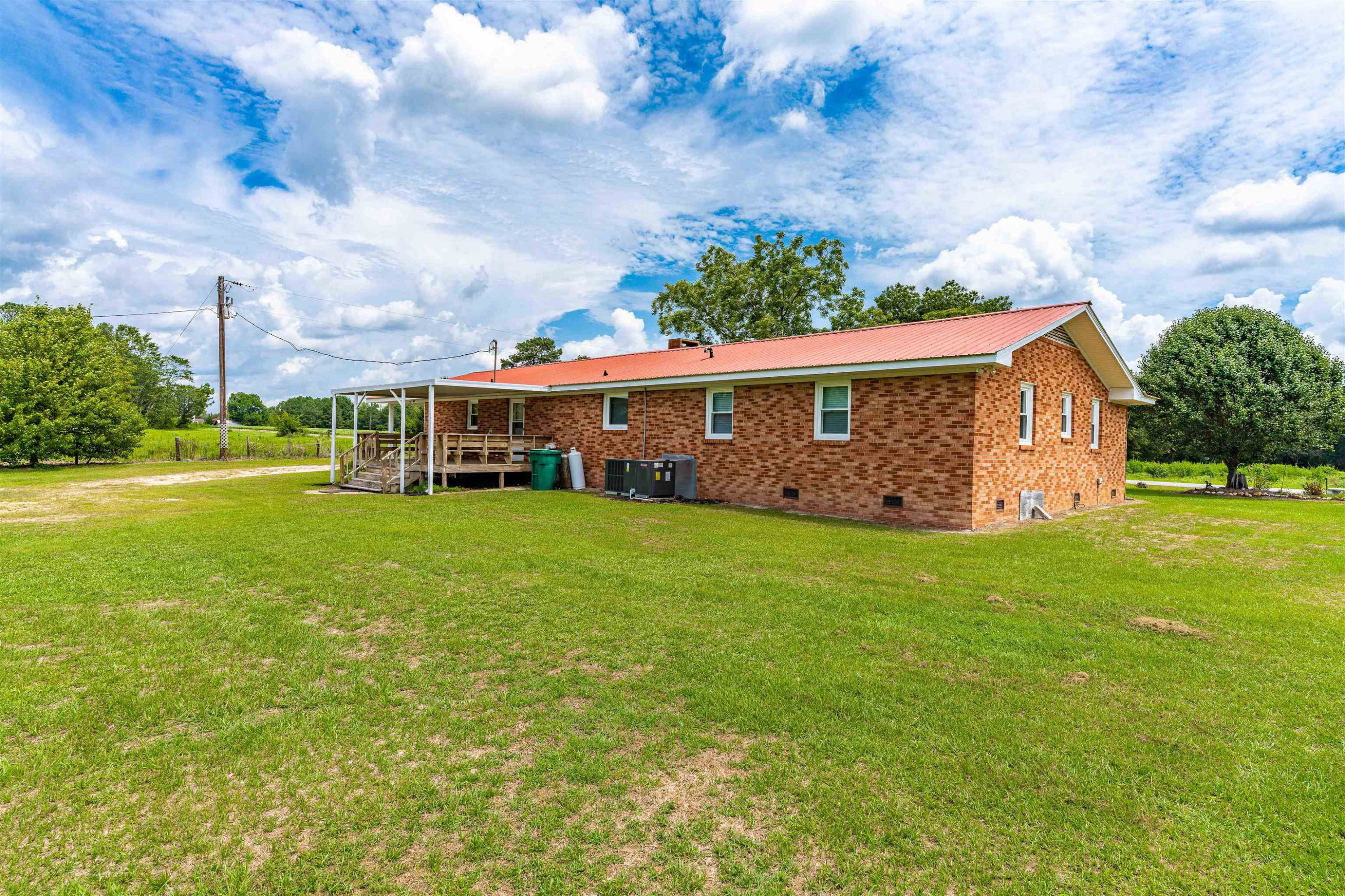 420 Faith Church Road Four Oaks, NC 27524 - Photo 4 of 36 a front view of a house with garden