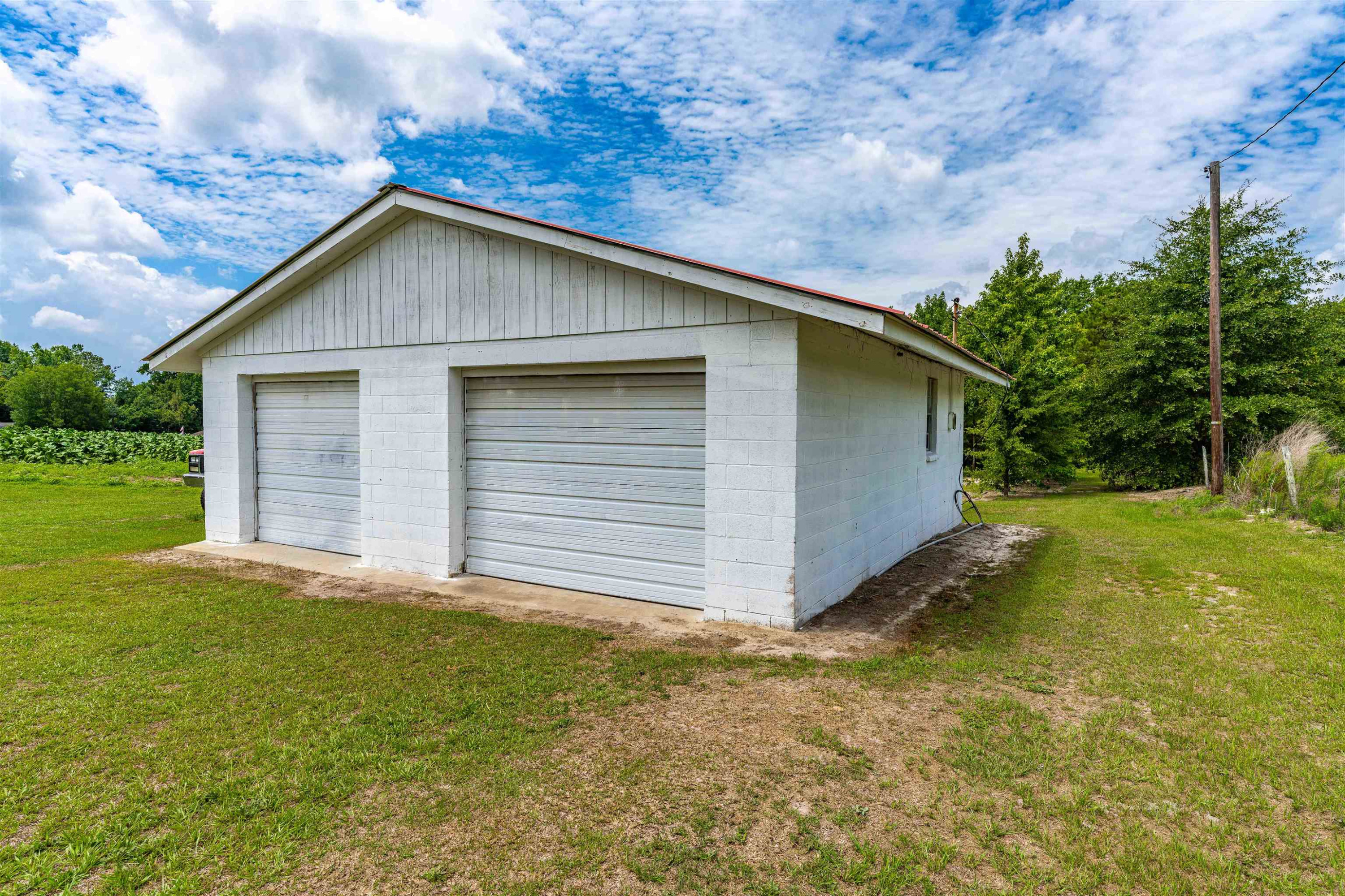 420 Faith Church Road Four Oaks, NC 27524 - Photo 8 of 36 a view of a house with a yard