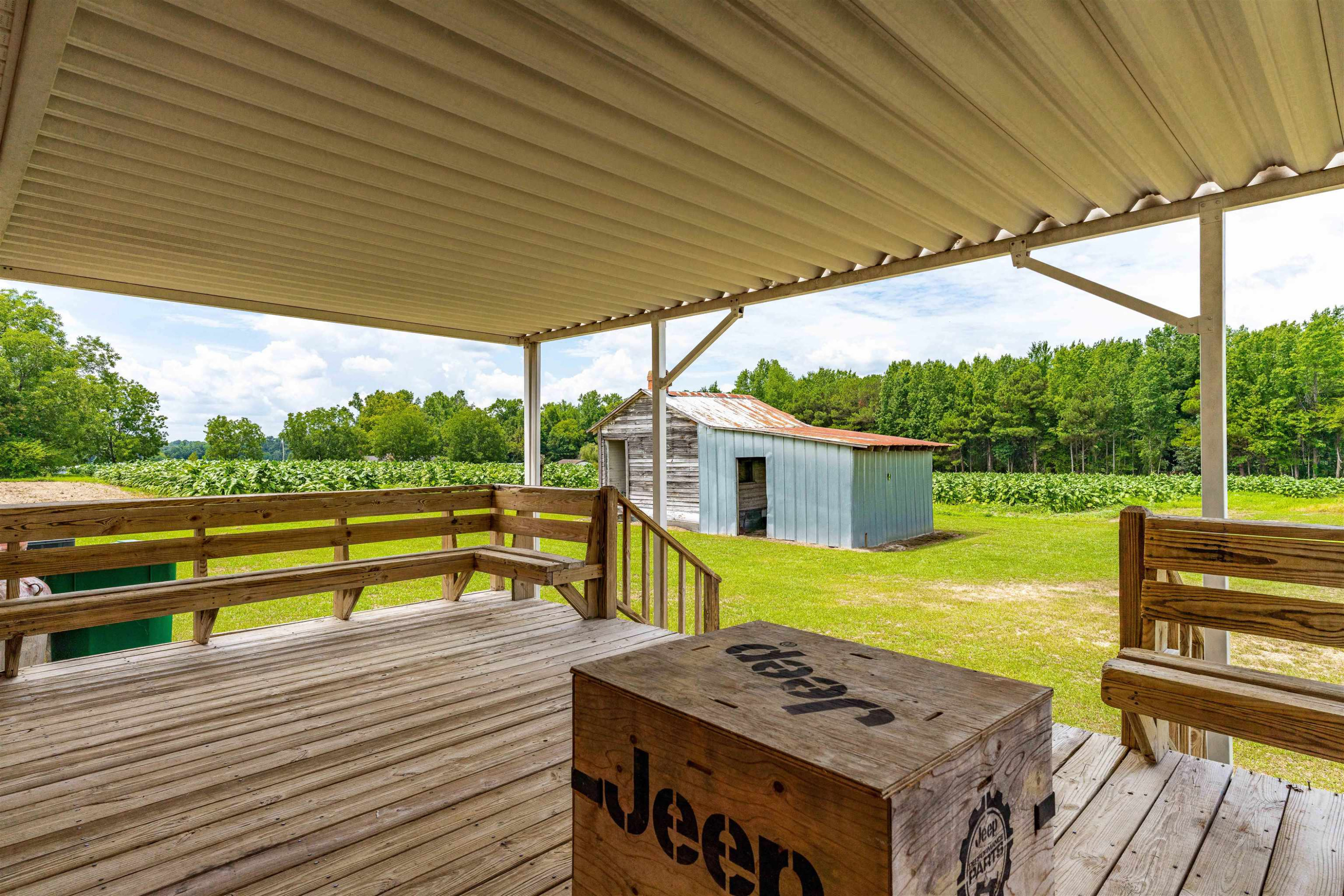 420 Faith Church Road Four Oaks, NC 27524 - Photo 10 of 36 a view of a patio with wooden floor next to a yard