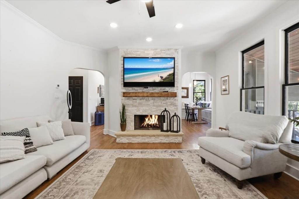 3222 Green Farm Trail Dacula, GA 30019 - Photo 17 of 92 a living room with furniture a flat screen tv and a fireplace