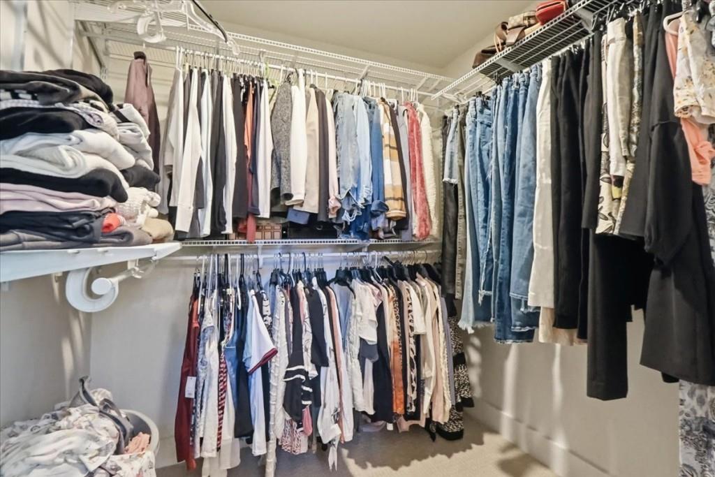 3222 Green Farm Trail Dacula, GA 30019 - Photo 47 of 92 a view of walk in closet with clothes