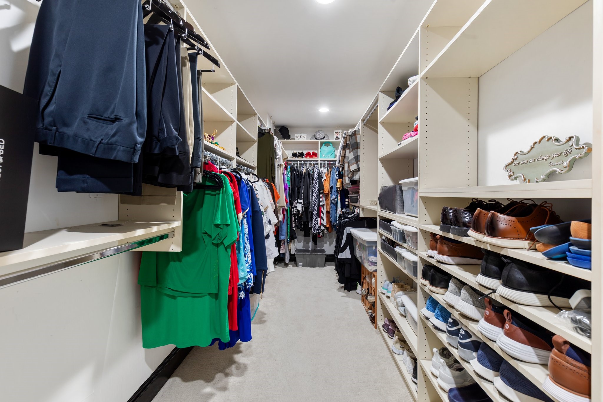 3350 McCue Road, Unit 2404 Houston, TX 77056 - Photo 34 of 49 a view of walk in closet with clothes and shoes