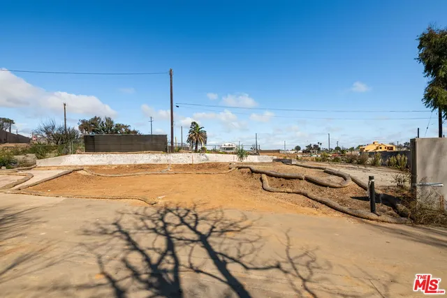a view of a playground with basketball court