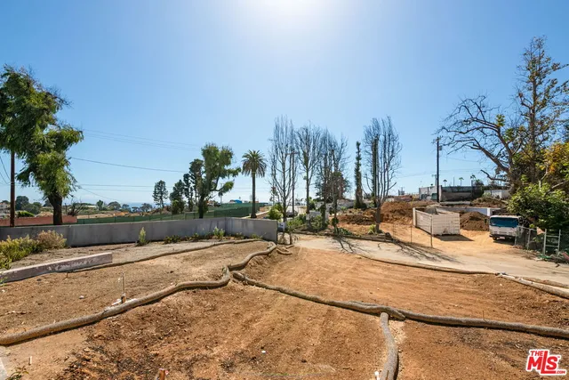 a view of a swimming pool with a lawn chairs