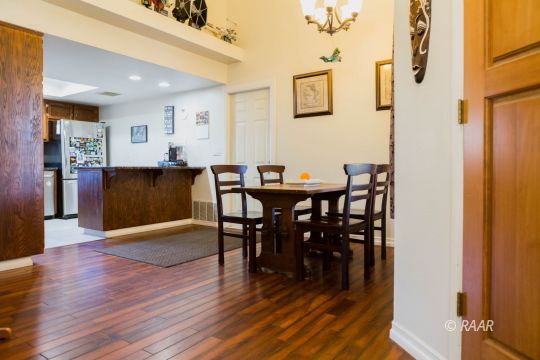 809 Charles Court Ridgecrest, CA 93555 - Photo 9 of 33 a view of a dining room with furniture and wooden floor