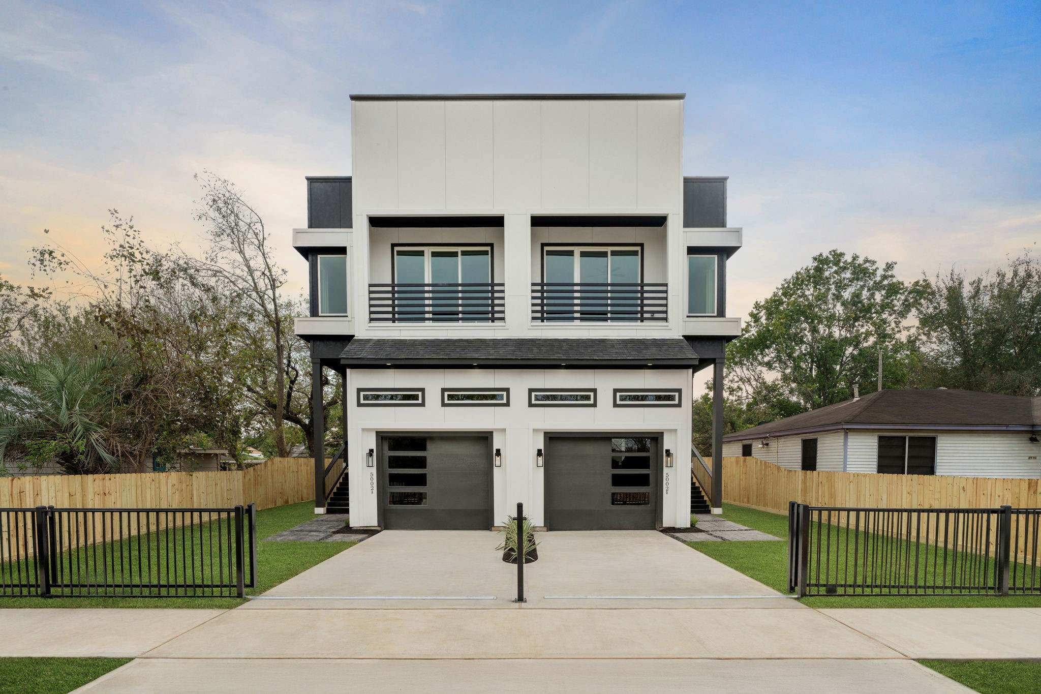 a front view of a house with garage