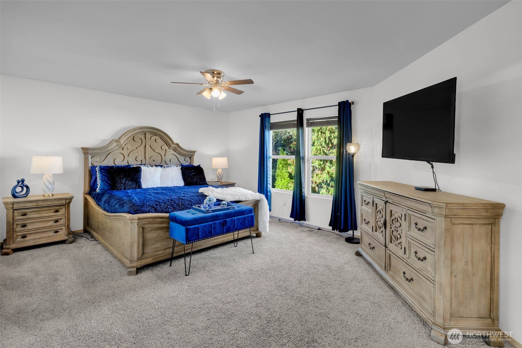 12830 Southeast 299th Street Auburn, WA 98092 - Photo 16 of 30 a living room with furniture and a flat screen tv