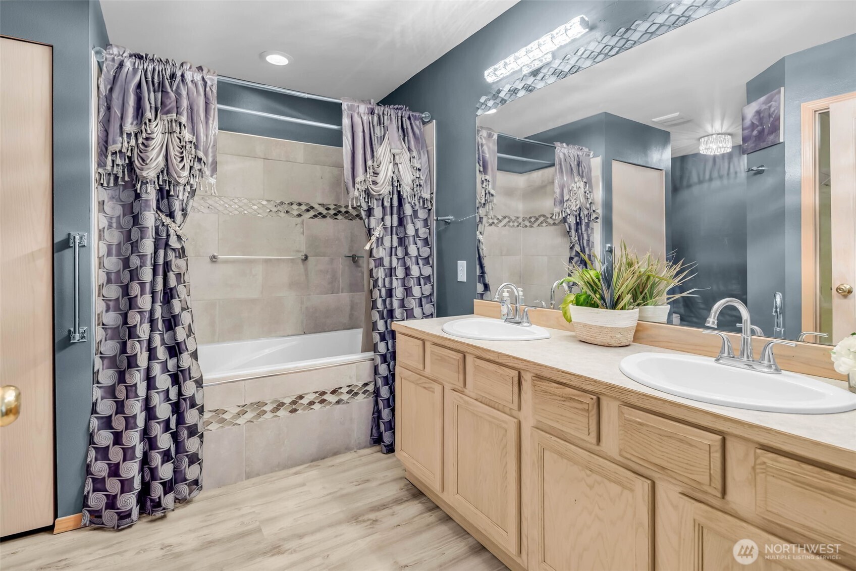 12830 Southeast 299th Street Auburn, WA 98092 - Photo 17 of 30 a bathroom with a double vanity sink toilet and shower