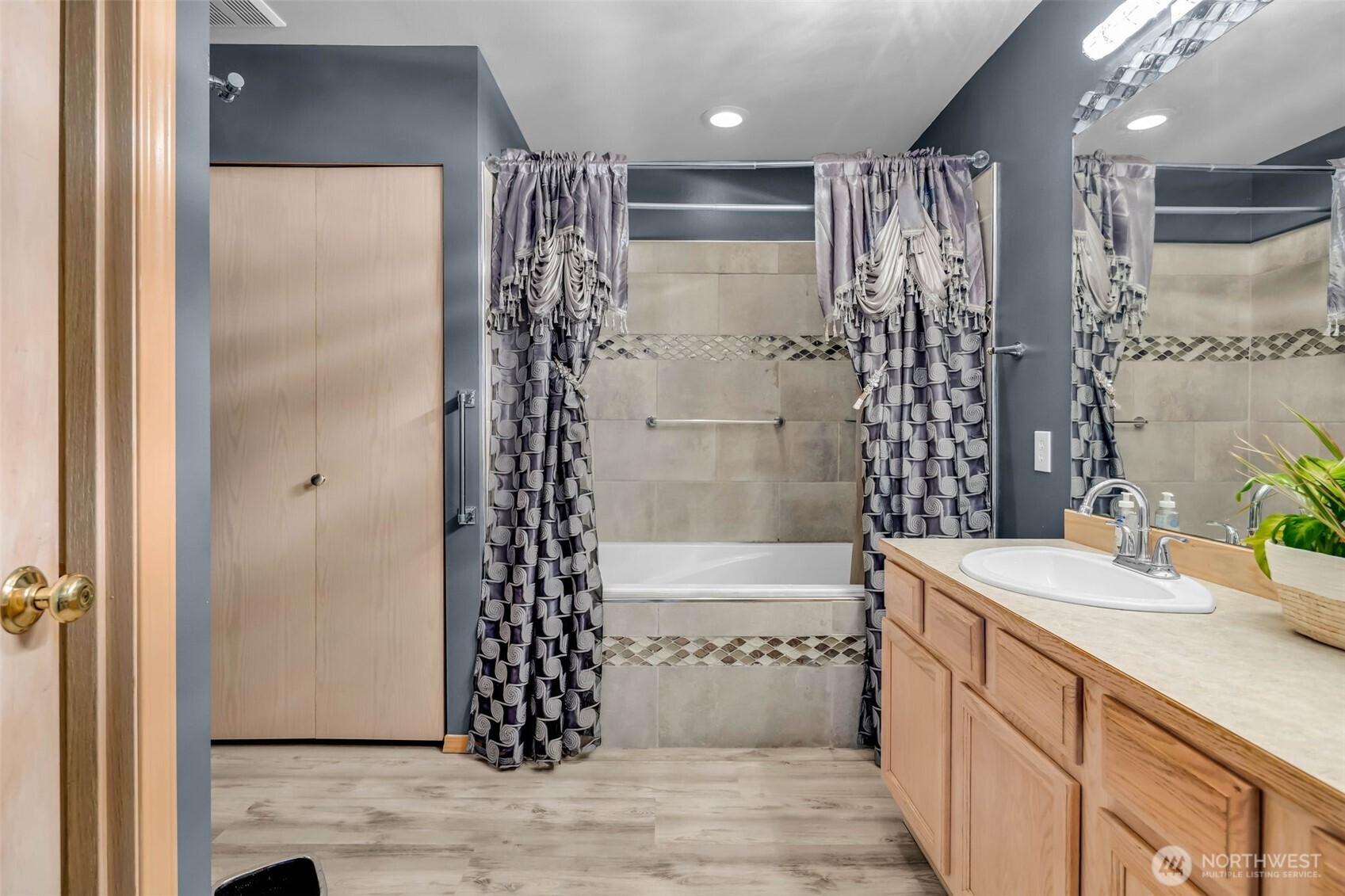 12830 Southeast 299th Street Auburn, WA 98092 - Photo 18 of 30 a bathroom with a sink a toilet and shower