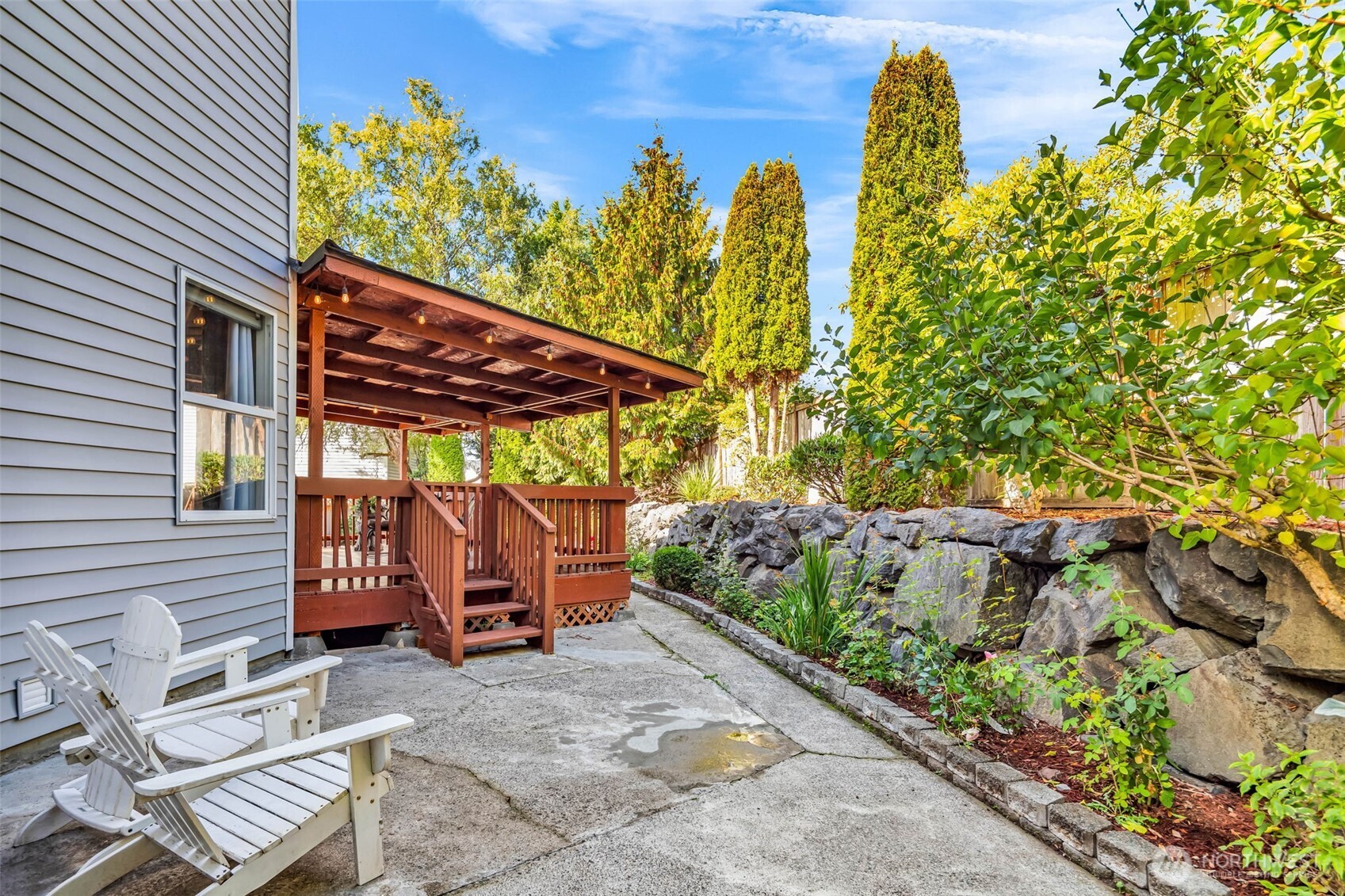 12830 Southeast 299th Street Auburn, WA 98092 - Photo 24 of 30 a view of a patio with table and chairs and potted plants
