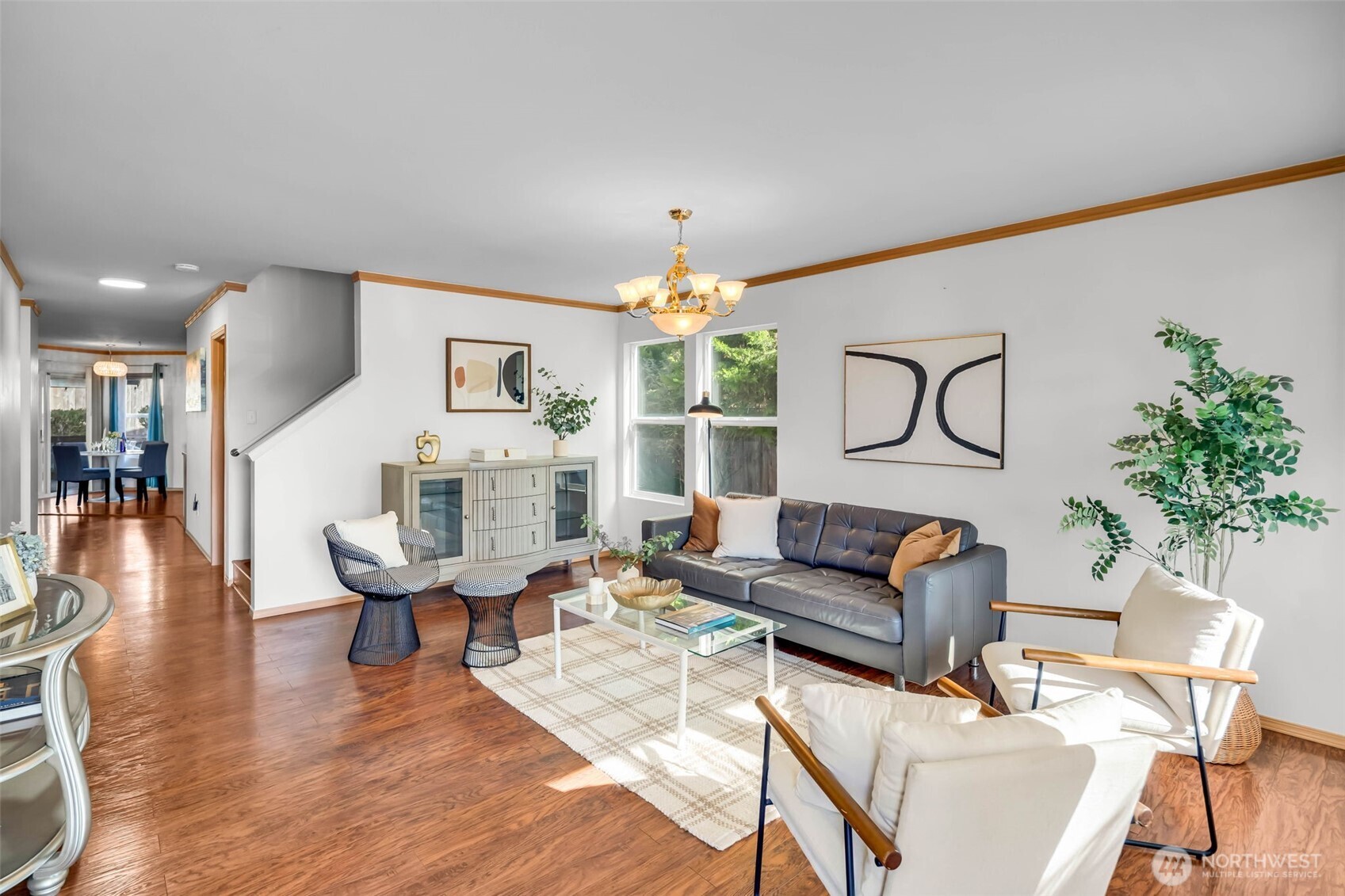 12830 Southeast 299th Street Auburn, WA 98092 - Photo 4 of 30 a living room with furniture a chandelier and wooden floor