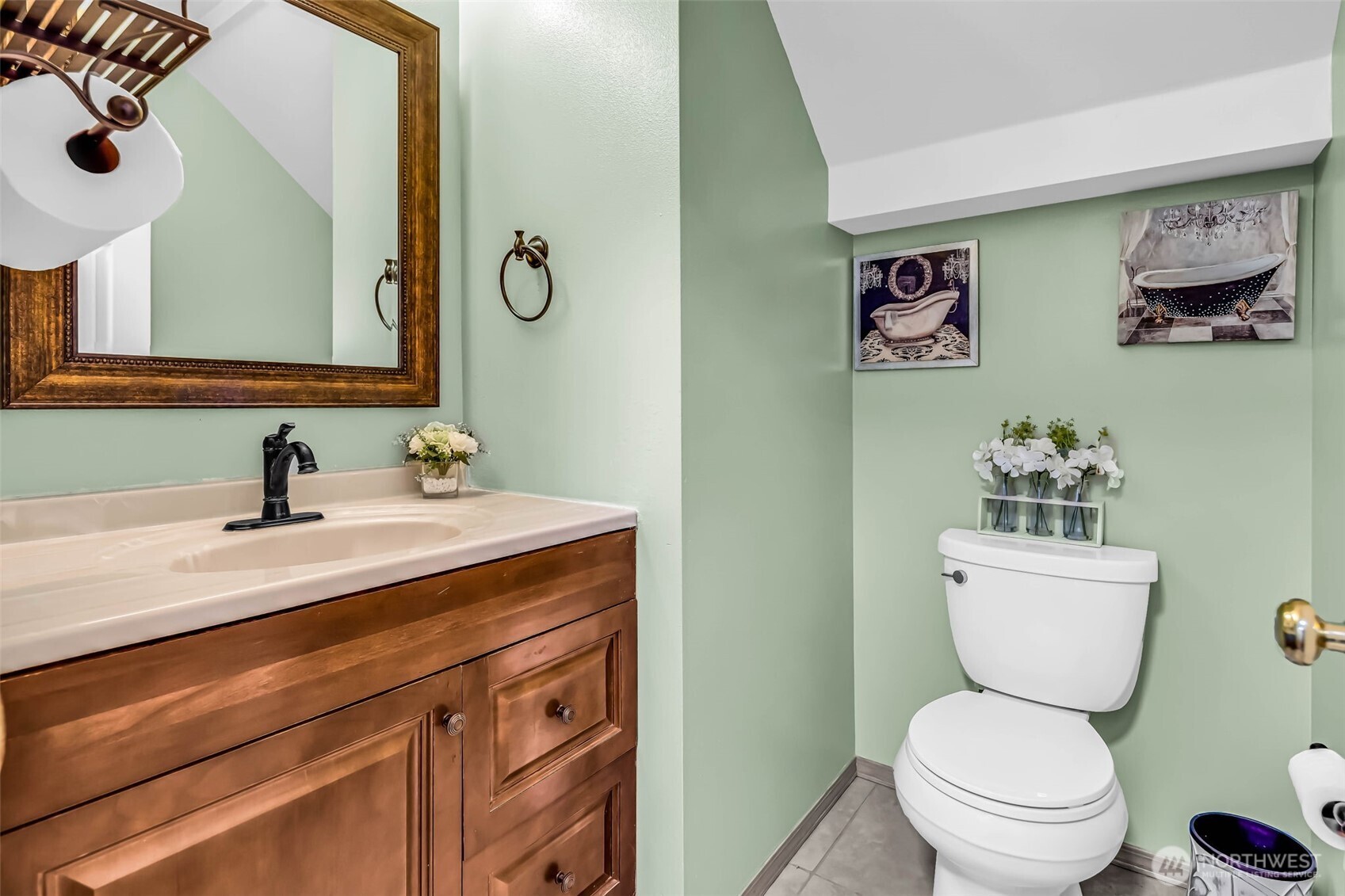 12830 Southeast 299th Street Auburn, WA 98092 - Photo 7 of 30 a bathroom with a toilet sink and mirror