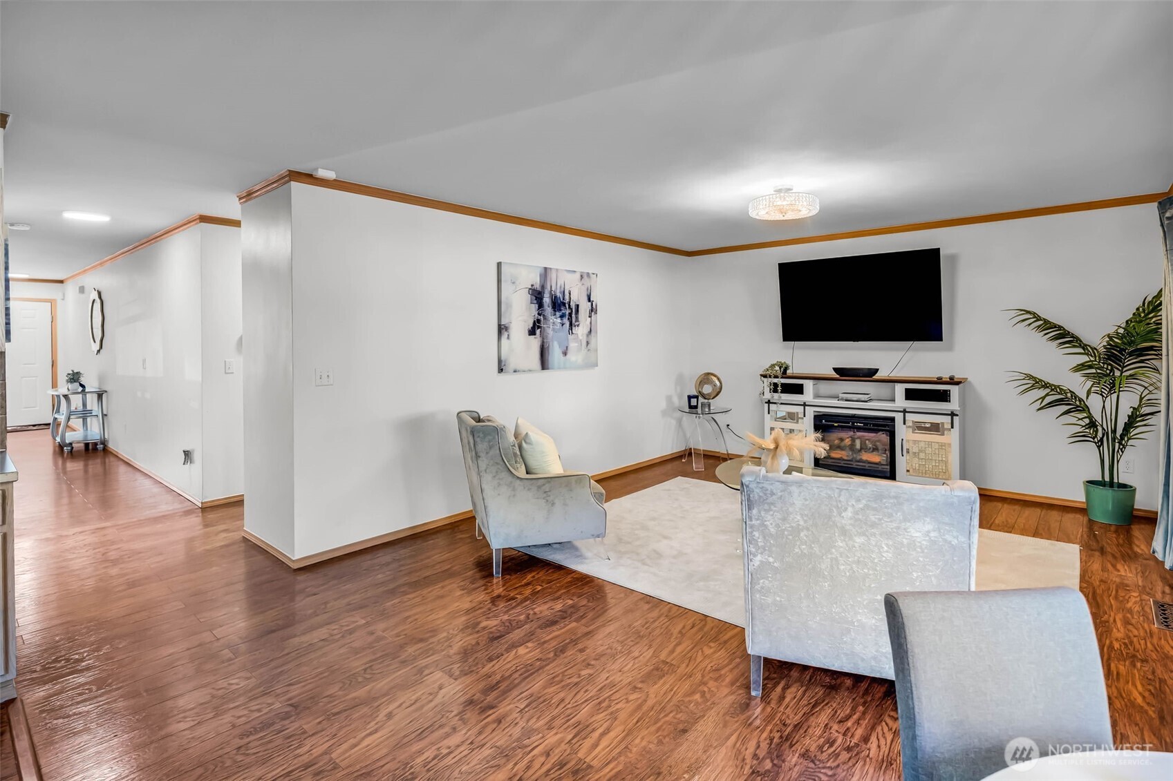 12830 Southeast 299th Street Auburn, WA 98092 - Photo 10 of 30 a living room with furniture and a flat screen tv