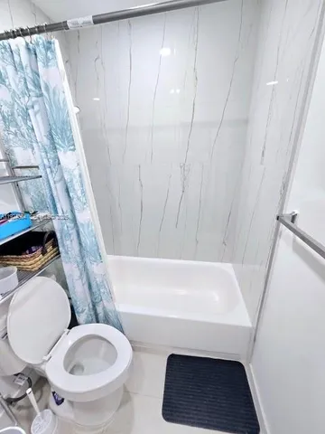 a bathroom with a toilet and a sink