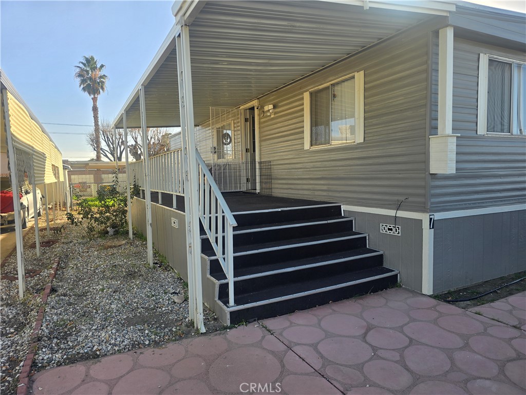 15252 Seneca Road, Unit 7 Victorville, CA 92392 - Photo 4 of 20 a view of a house with a yard and stairs
