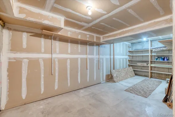 a view of an empty room with a staircase