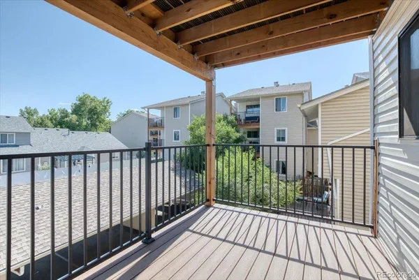 a view of a balcony with wooden floor