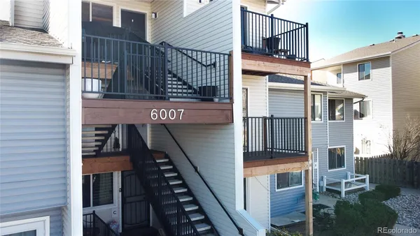a view of a house with entrance and stairs