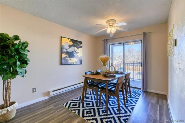 a view of a dining room with furniture window and wooden floor